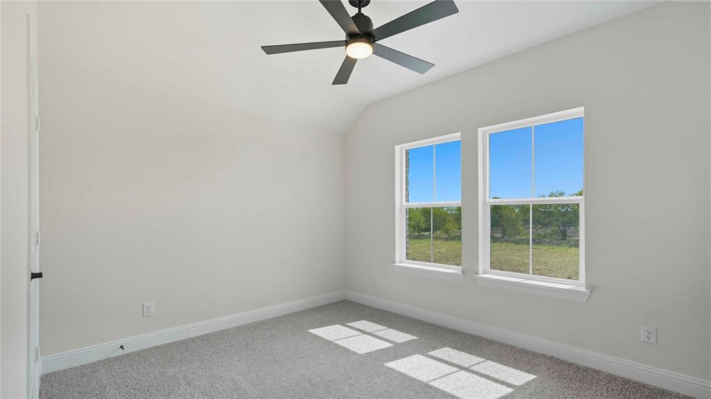 1011 Pitchfork Road Royse City, TX 75189 - Photo 14 of 19 an empty room with a window and a fan