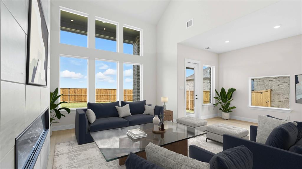 1011 Pitchfork Road Royse City, TX 75189 - Photo 3 of 19 a living room with furniture and large windows