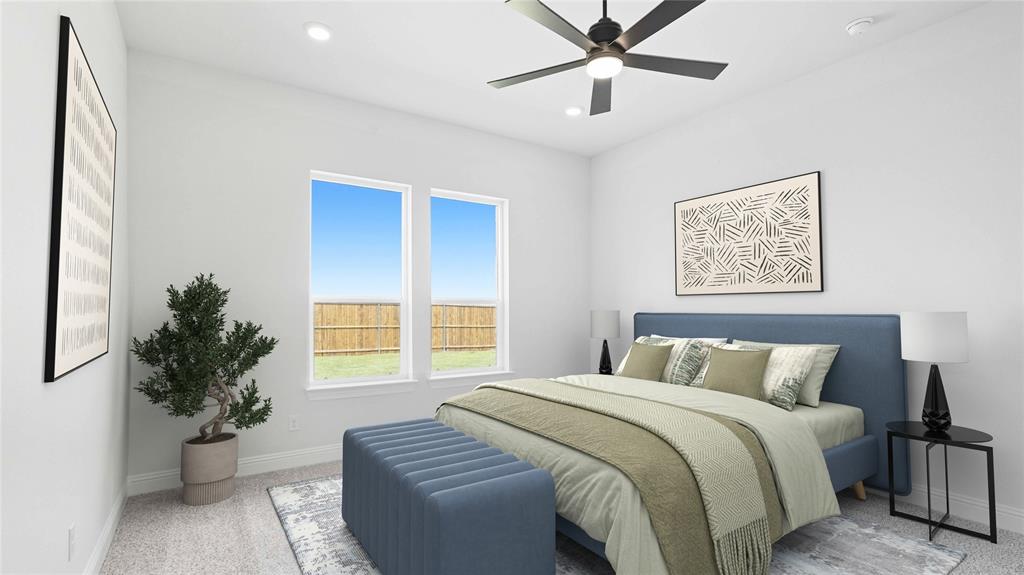 1011 Pitchfork Road Royse City, TX 75189 - Photo 9 of 19 a bedroom with a large bed and a potted plant