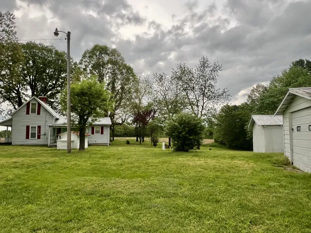 a view of a tree in front of a house