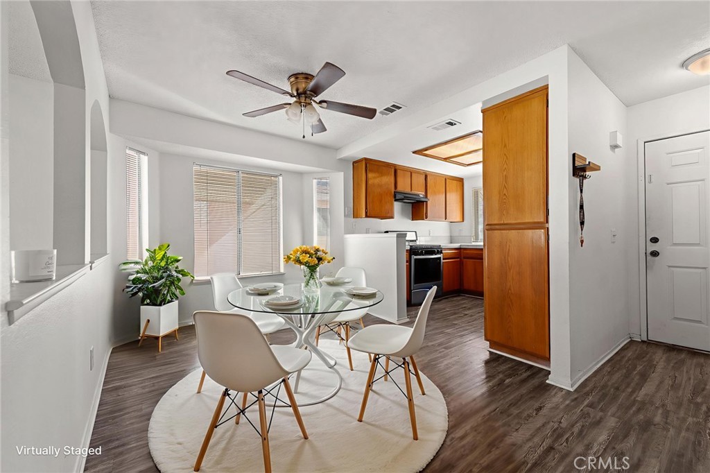 786 Zephyr Circle Hemet, CA 92543 - Photo 24 of 26 a view of a dining room with furniture window and wooden floor