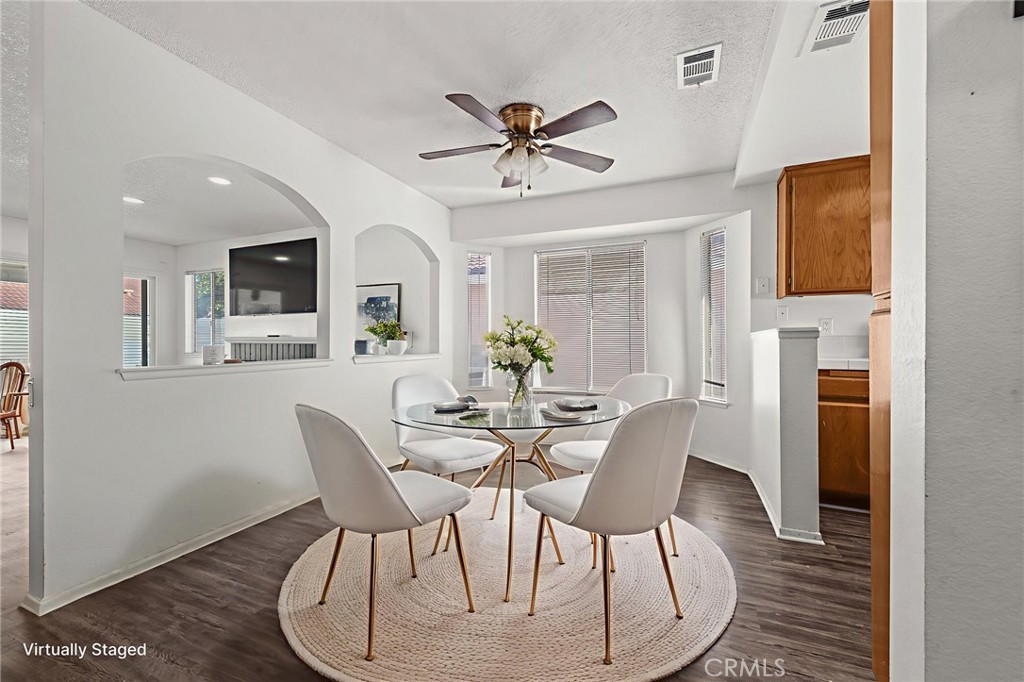 786 Zephyr Circle Hemet, CA 92543 - Photo 25 of 26 a view of a dining room with furniture and wooden floor
