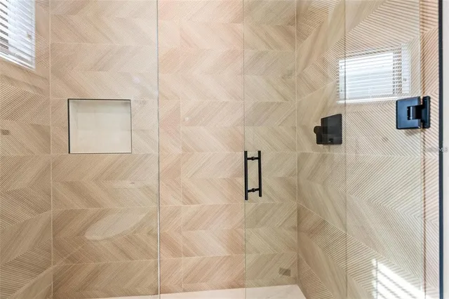 a bedroom with a bed and flat screen tv