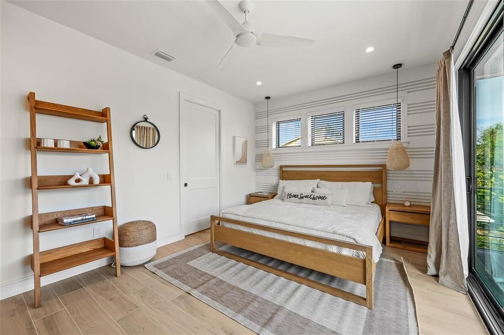 112 Maple Avenue Anna Maria, FL 34216 - Photo 36 of 100 a bedroom with a bed and a window