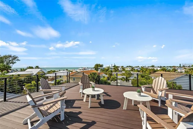 a view of a chairs and table on the terrace