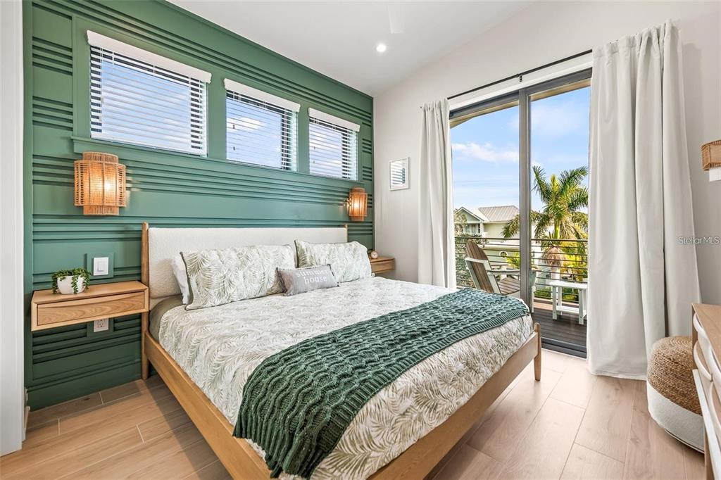 112 Maple Avenue Anna Maria, FL 34216 - Photo 55 of 100 a bedroom with a bed and a window