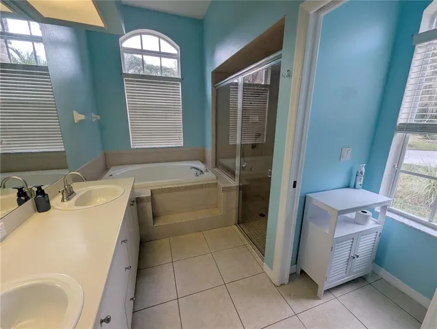 a bathroom with a sink and shower