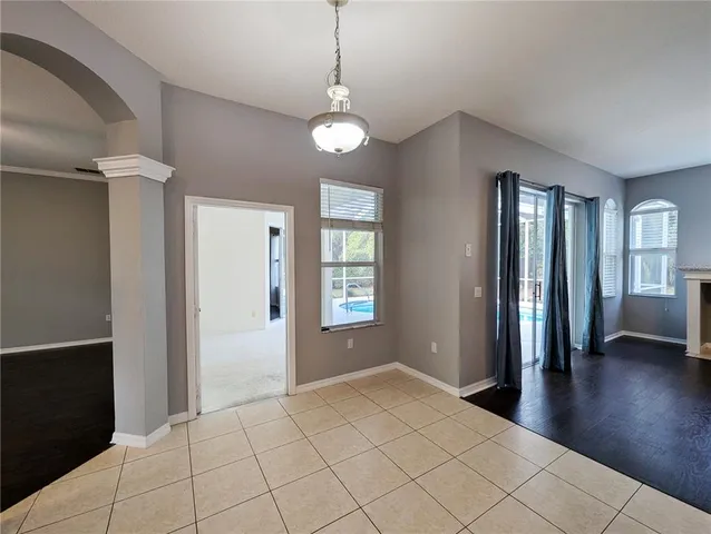 a kitchen with furniture and a refrigerator
