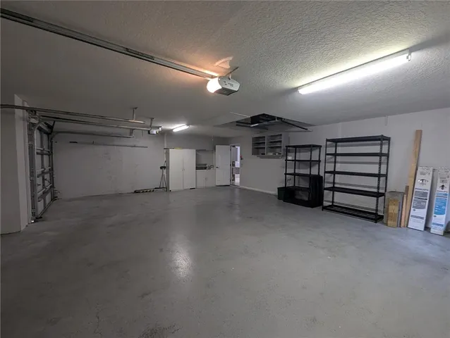 a view of a living room with a fireplace