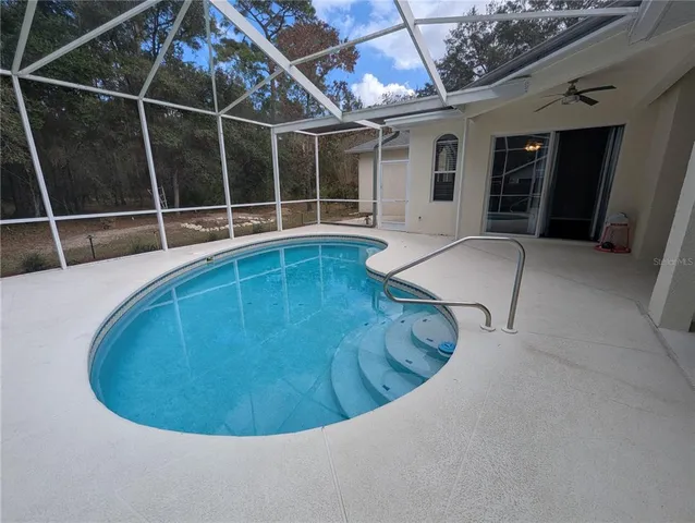 a view of a swimming pool with a large window