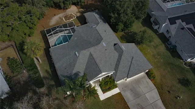 an aerial view of a house with outdoor space