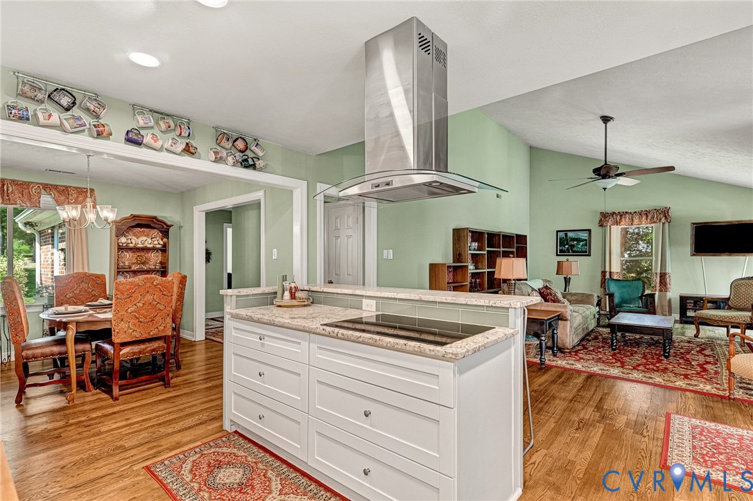 3841 Strawhill Road Richmond, VA 23231 - Photo 9 of 56 Kitchen island with a built-in cooktop, light-tone