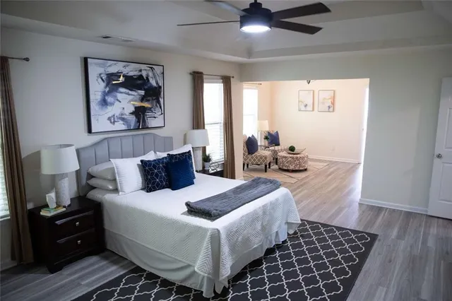 a bedroom with bed and window