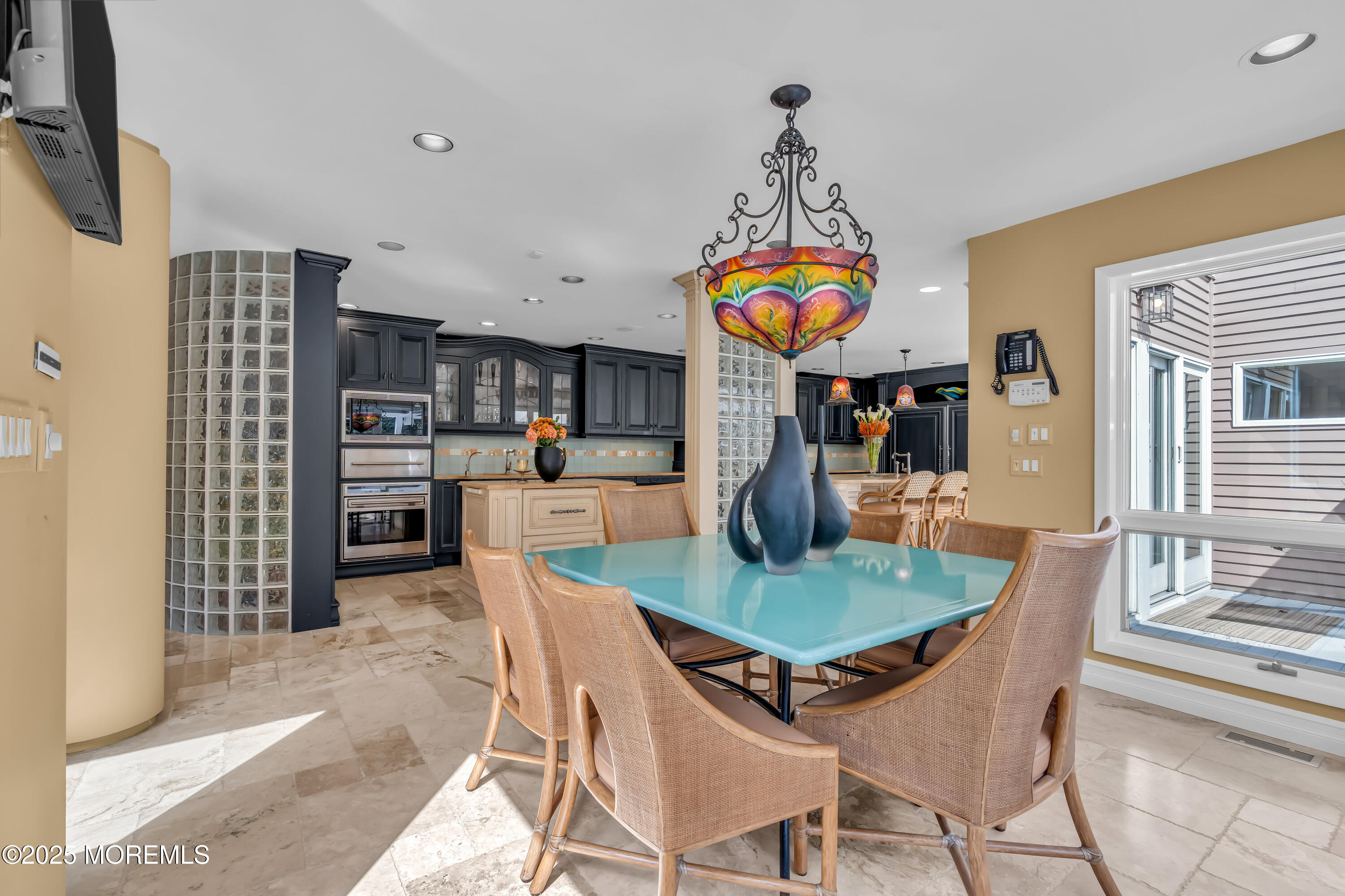 1264 Deal Road Asbury Park, NJ 07712 - Photo 18 of 70 a view of a dining room and kitchen with furniture wooden floor and a rug