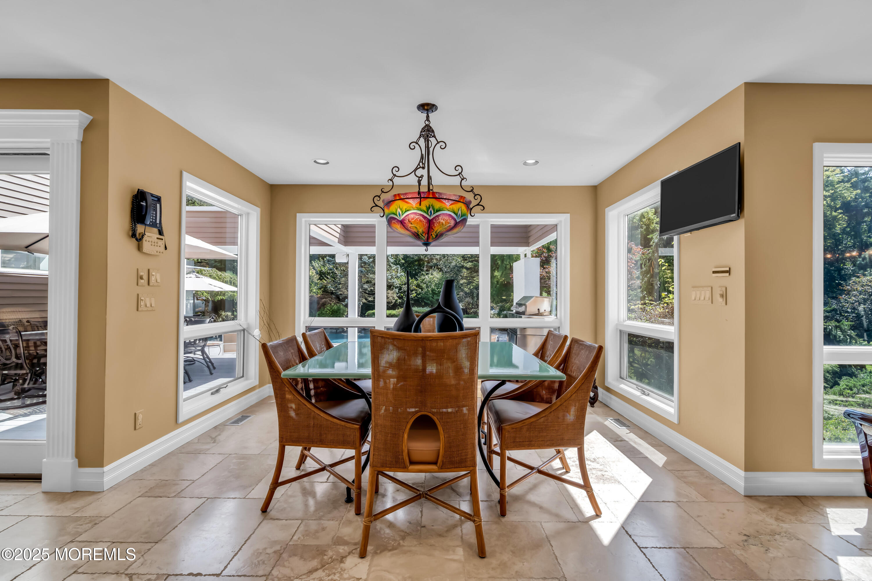 1264 Deal Road Asbury Park, NJ 07712 - Photo 19 of 70 a dining room with furniture large windows and a chandelier
