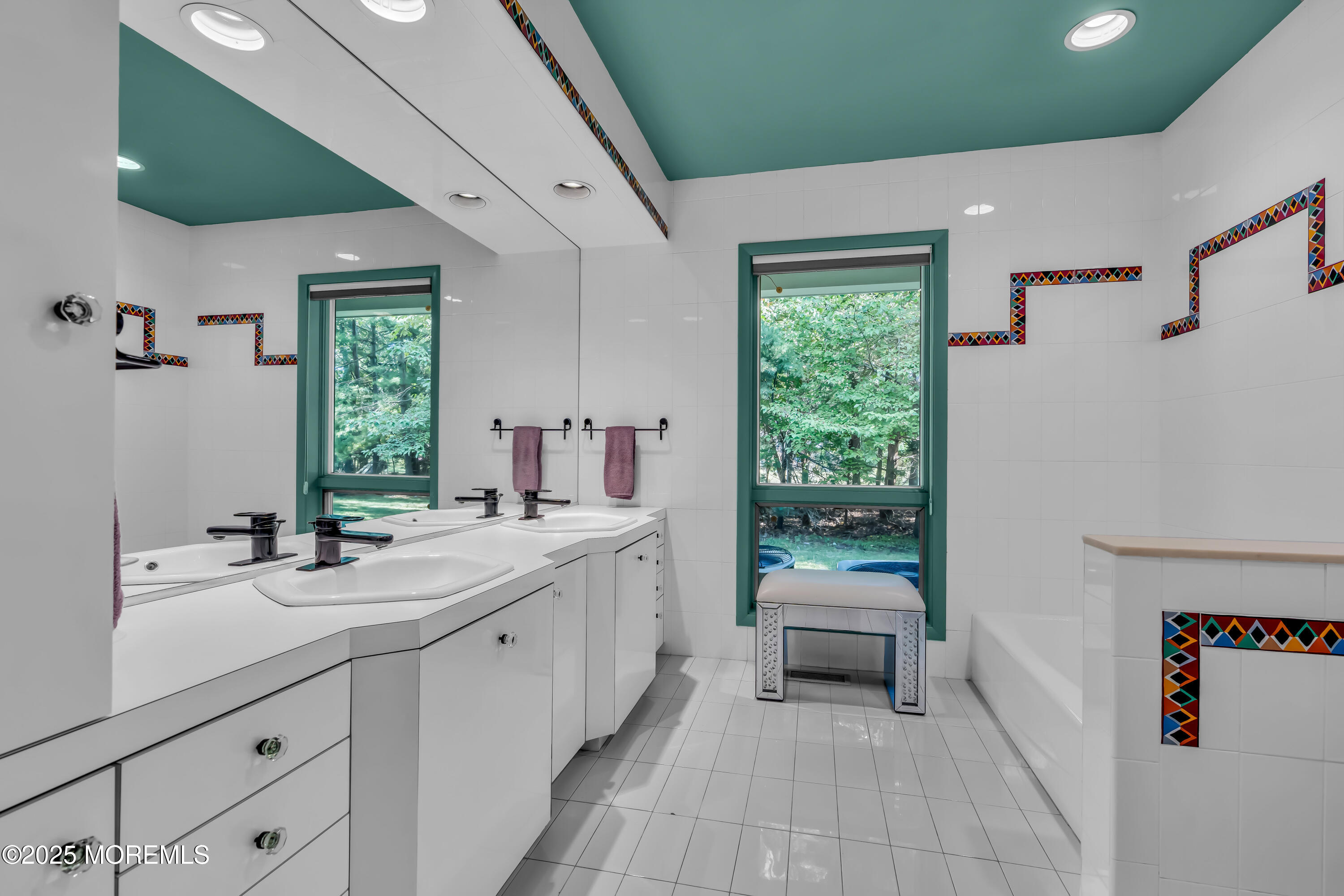 1264 Deal Road Asbury Park, NJ 07712 - Photo 31 of 70 a bathroom with a granite countertop sink mirror and a bathtub