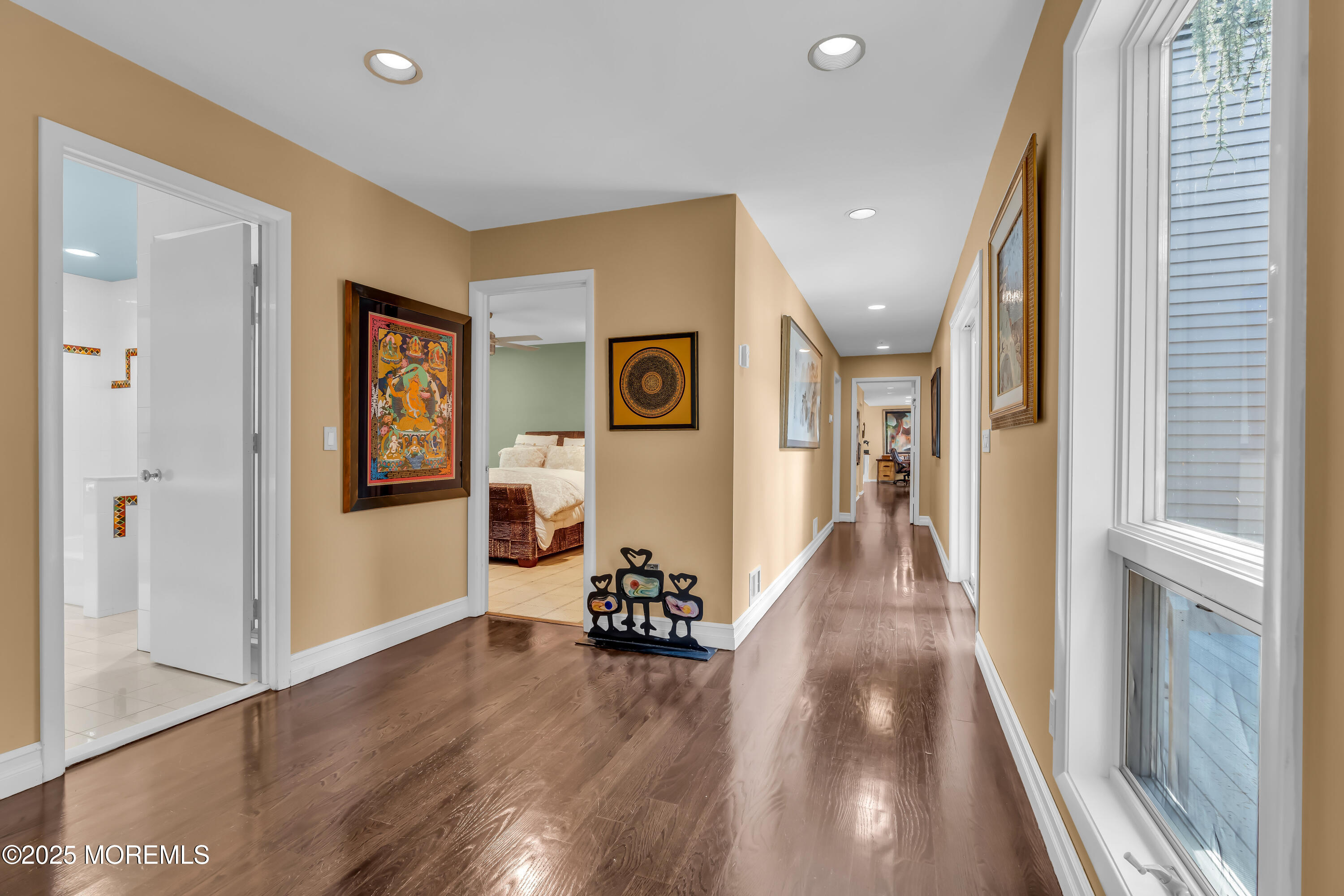 1264 Deal Road Asbury Park, NJ 07712 - Photo 34 of 70 a view of a hallway with wooden floor and stairs