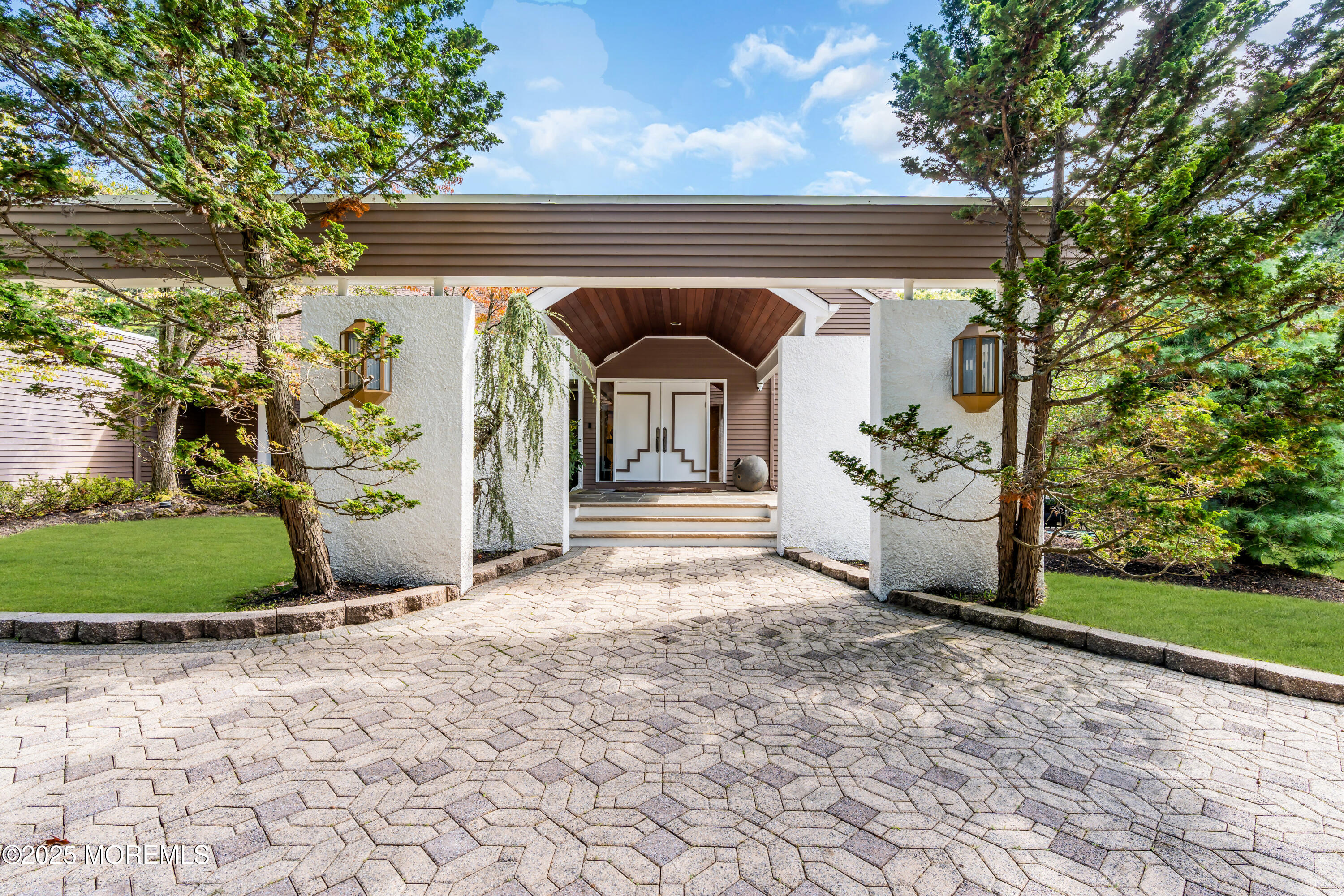 1264 Deal Road Asbury Park, NJ 07712 - Photo 4 of 70 a front view of a house with a yard and garage