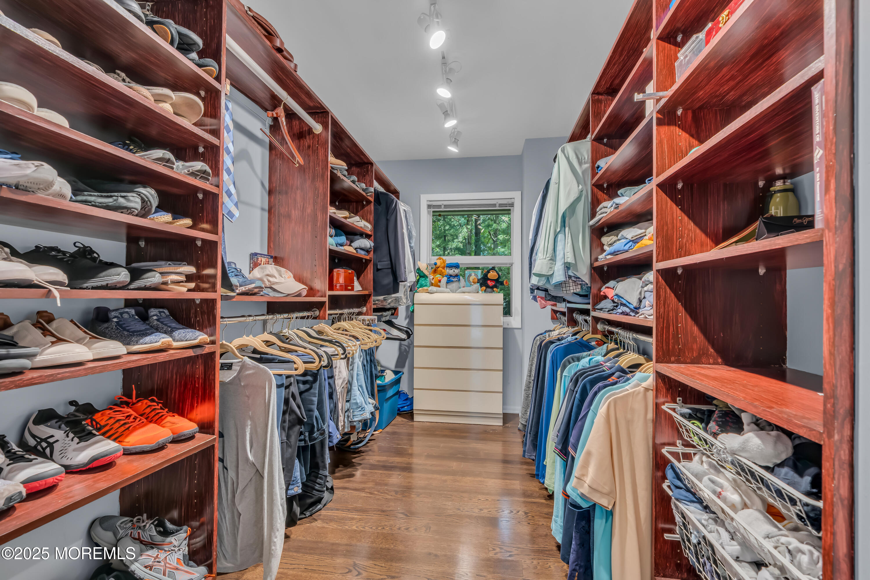 1264 Deal Road Asbury Park, NJ 07712 - Photo 46 of 70 a view of walk in closet with clothes and shoes