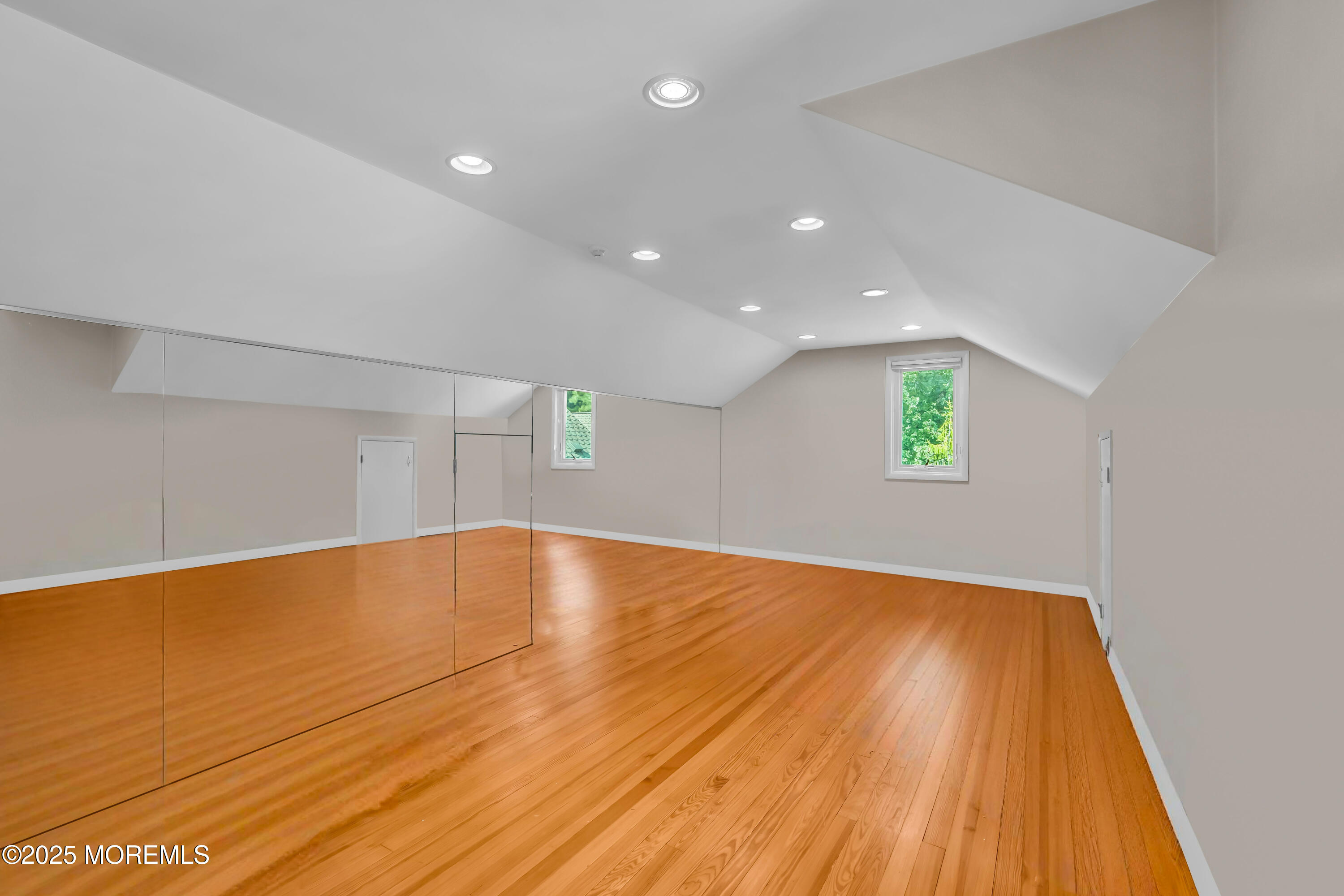 1264 Deal Road Asbury Park, NJ 07712 - Photo 55 of 70 a view of empty room with wooden floor and fan