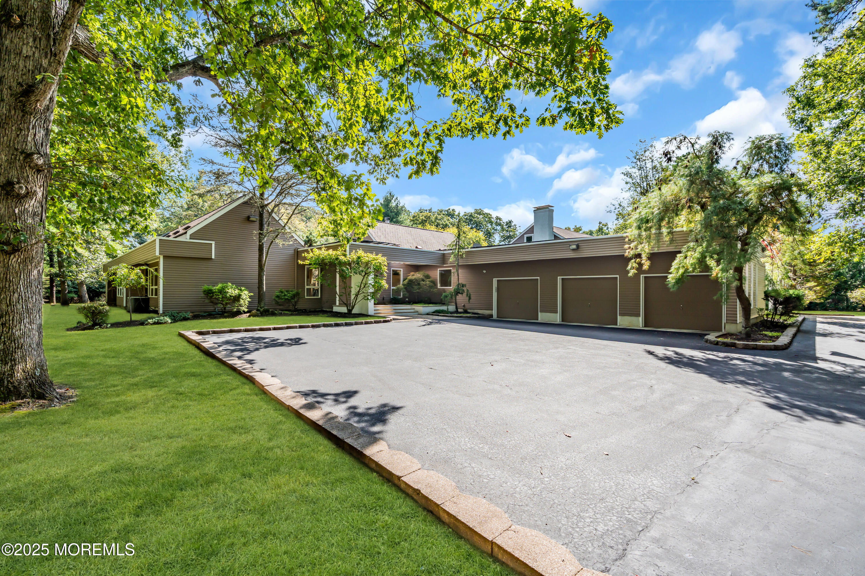 1264 Deal Road Asbury Park, NJ 07712 - Photo 57 of 70 a front view of a house with a yard and garage