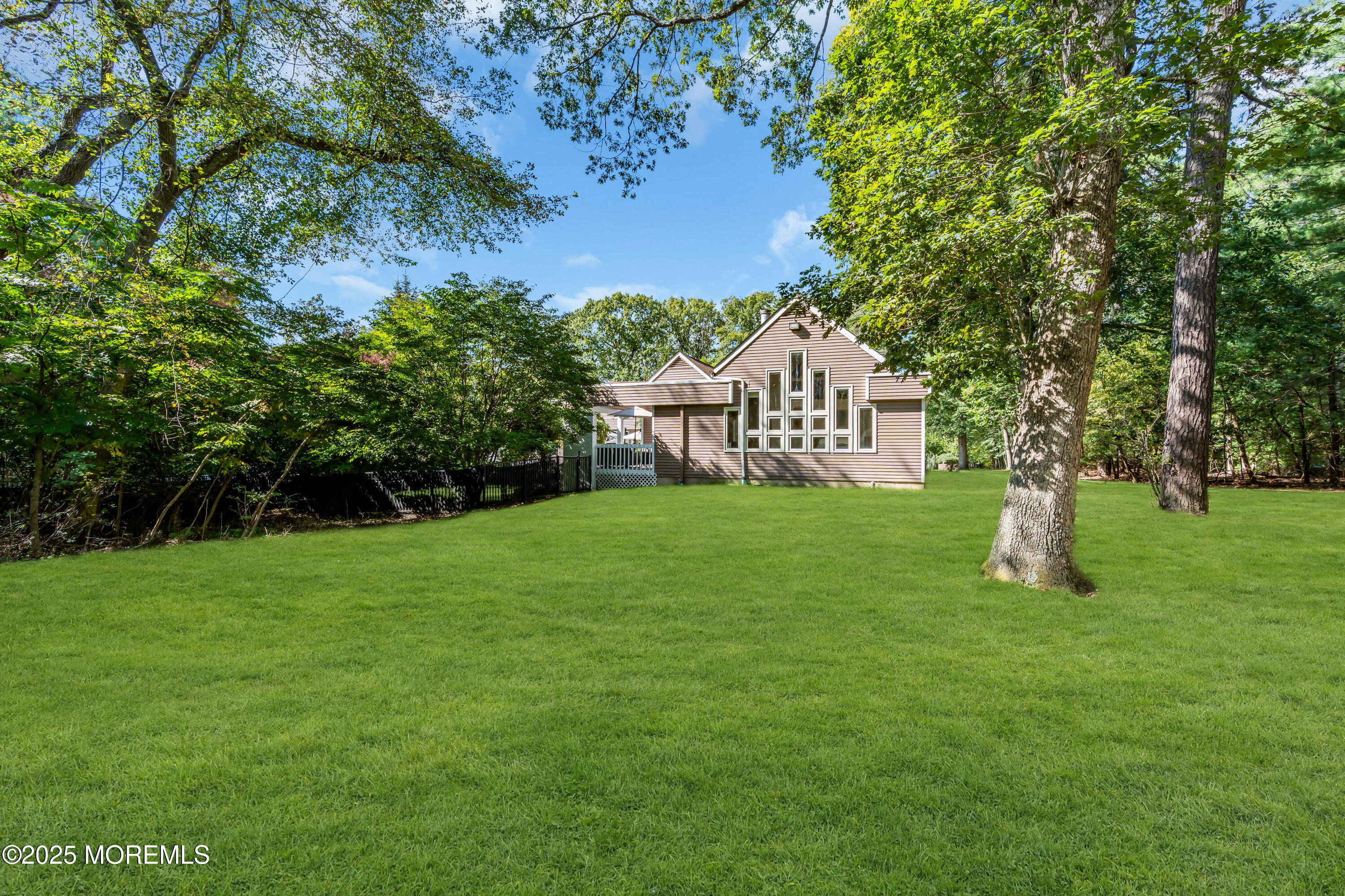 1264 Deal Road Asbury Park, NJ 07712 - Photo 61 of 70 a view of a house with a yard porch and sitting area