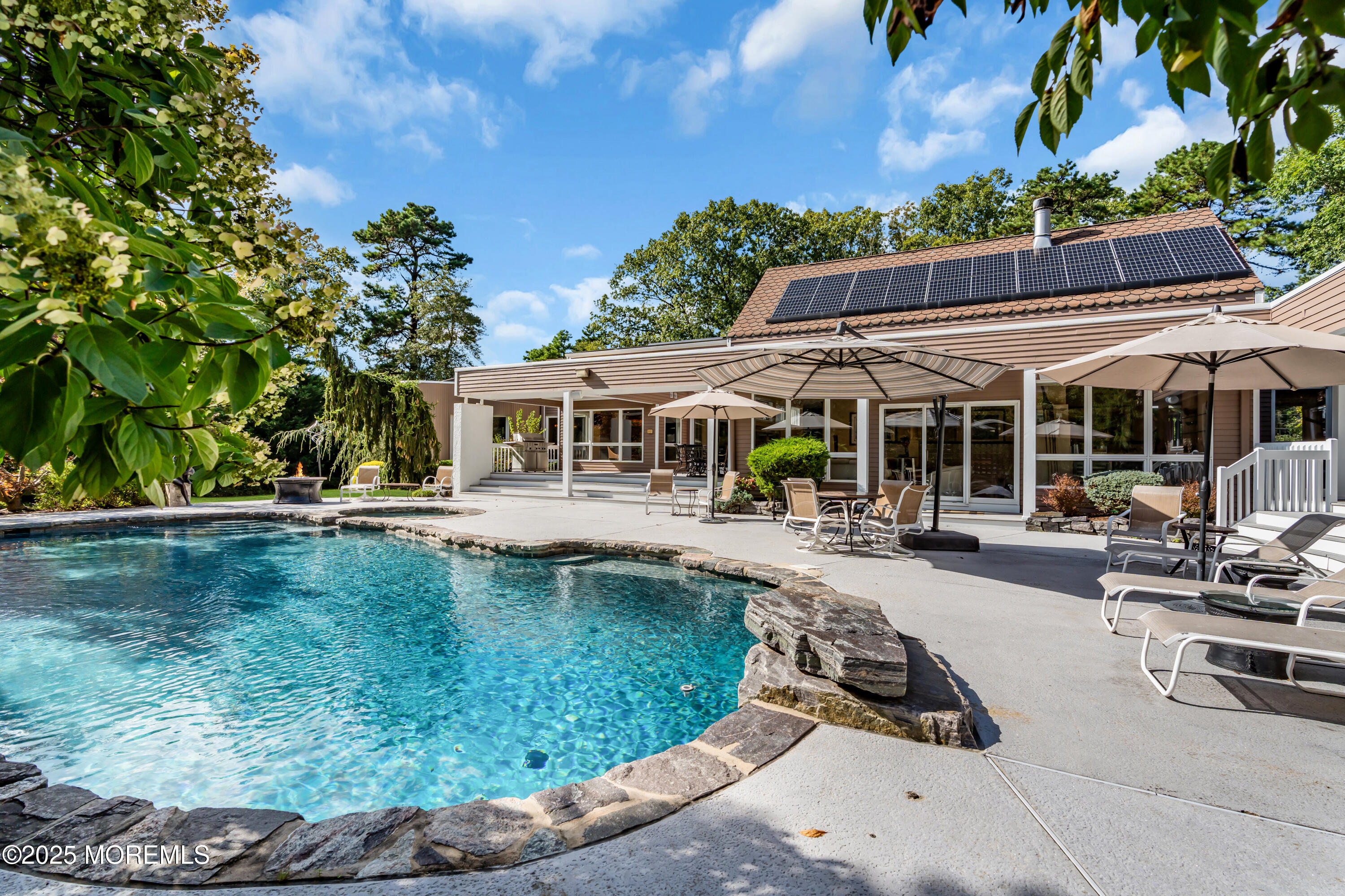 1264 Deal Road Asbury Park, NJ 07712 - Photo 68 of 70 a view of a house with swimming pool and sitting area