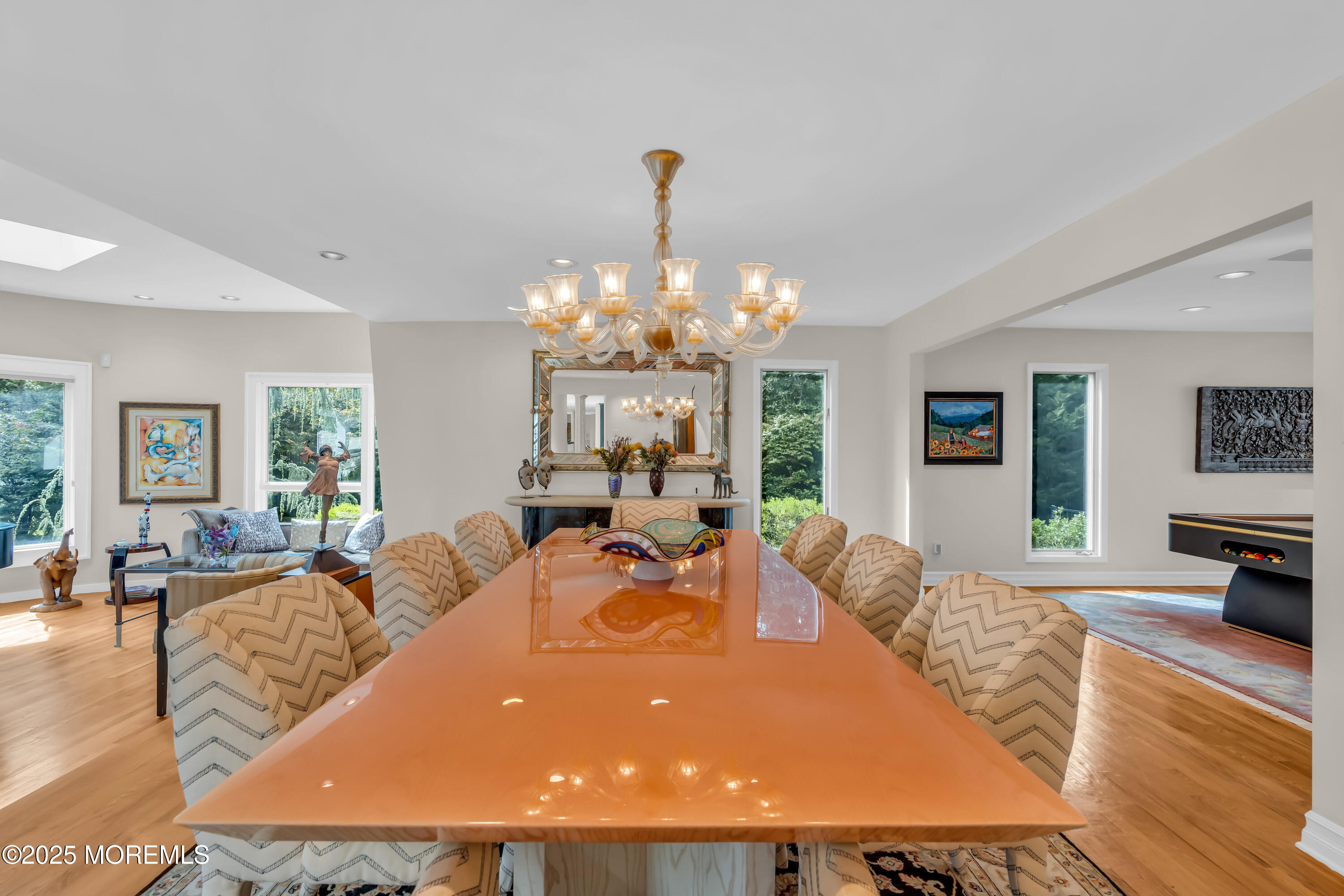 1264 Deal Road Asbury Park, NJ 07712 - Photo 8 of 70 a living room with furniture a chandelier a large window and wooden floor