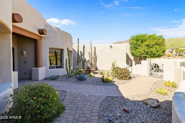 a view of a terrace with couches and potted plants