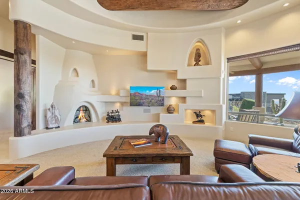 a view of a terrace with couches and sky view