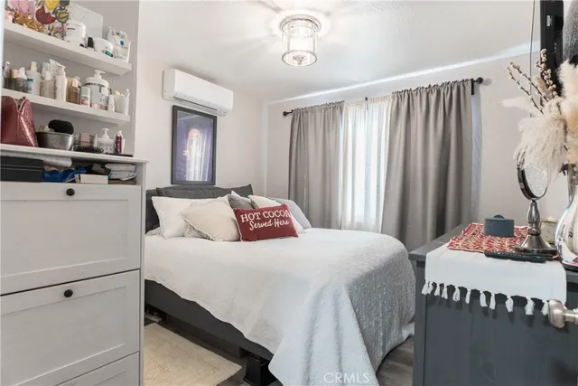 a bedroom with a bed and a table in it