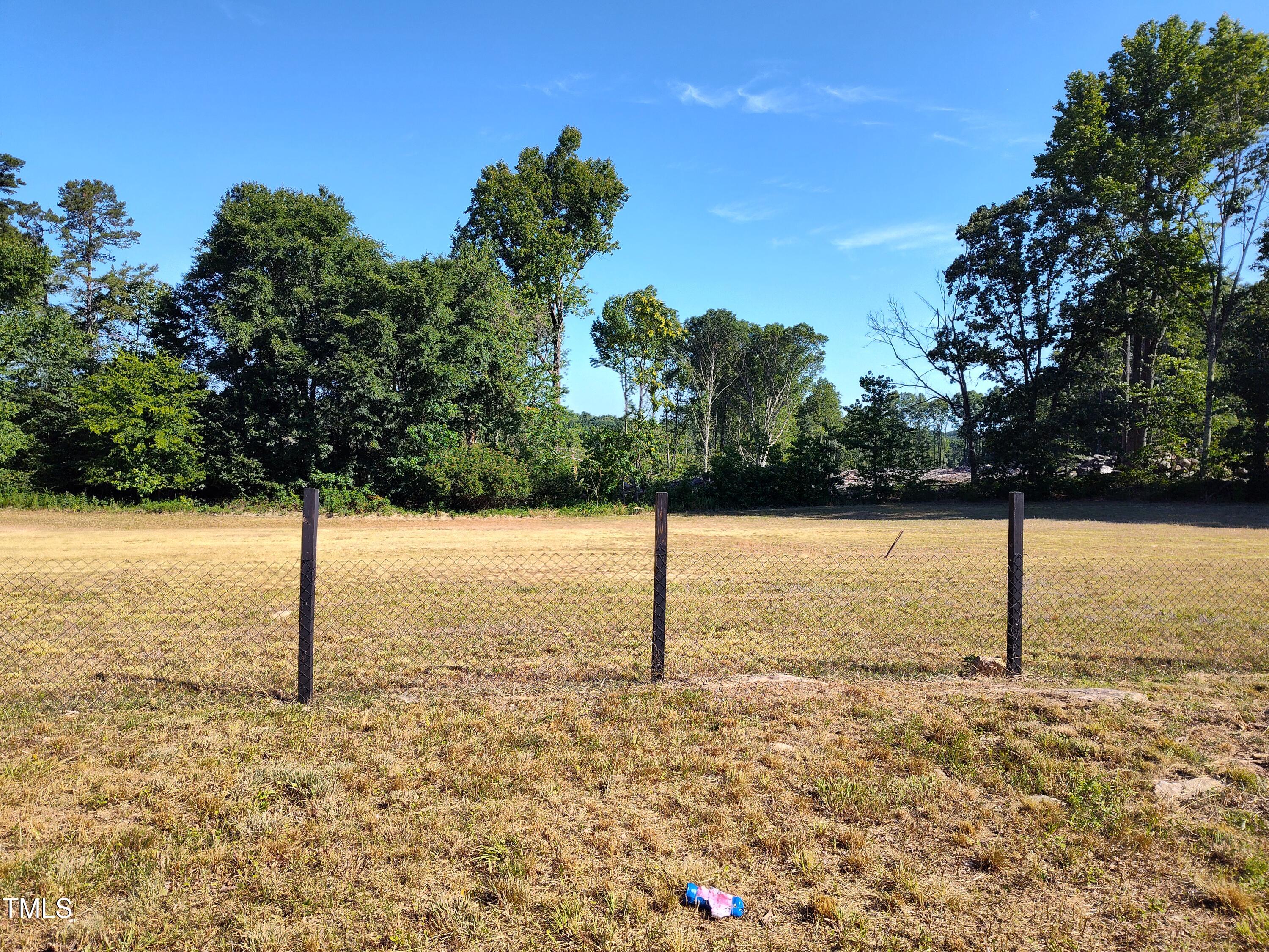 0 Allensville Road Roxboro, NC 27574 - Photo 6 of 7 a street sign on a sidewalk next to a road