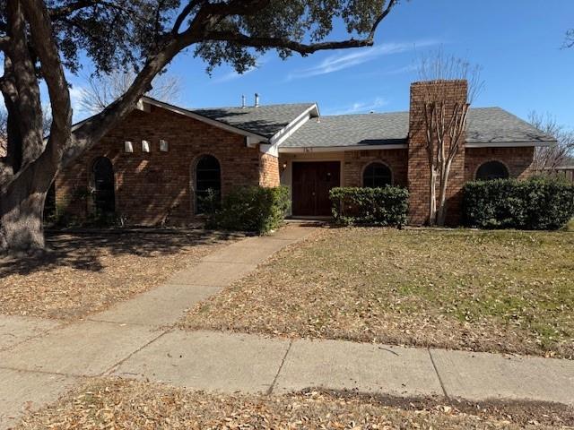 3305 Ridgemoor Drive Garland, TX 75044 - Photo 1 of 1 Ranch-style house featuring a front yard, brick siding, and a chimney