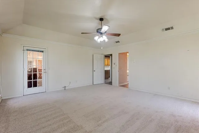 a view of a hallway with wooden floor and closet