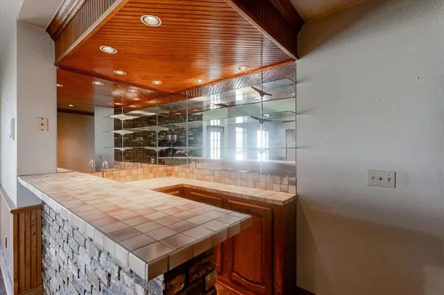 a view of a room with wooden floor and window