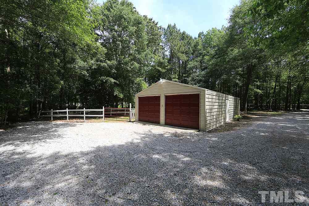 1295 Pilot-Riley Road Zebulon, NC 27597 - Photo 12 of 18 a view of a house with a backyard