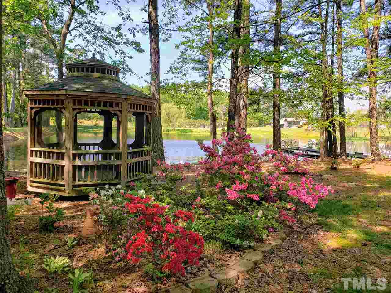 1295 Pilot-Riley Road Zebulon, NC 27597 - Photo 15 of 18 a small garden covered with tall buildings