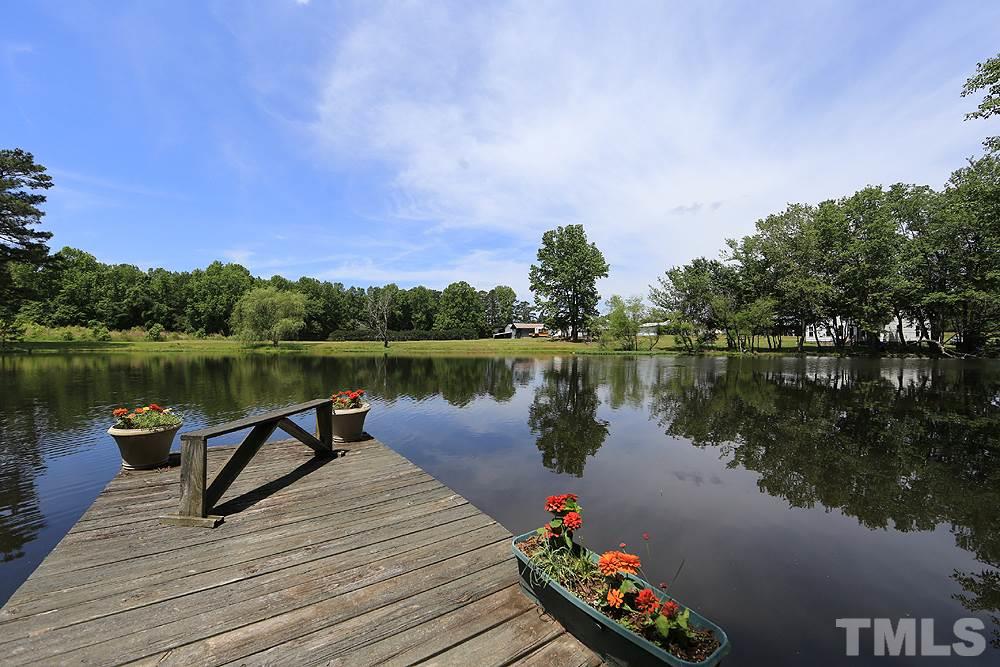 1295 Pilot-Riley Road Zebulon, NC 27597 - Photo 16 of 18 a lake view with a lake view