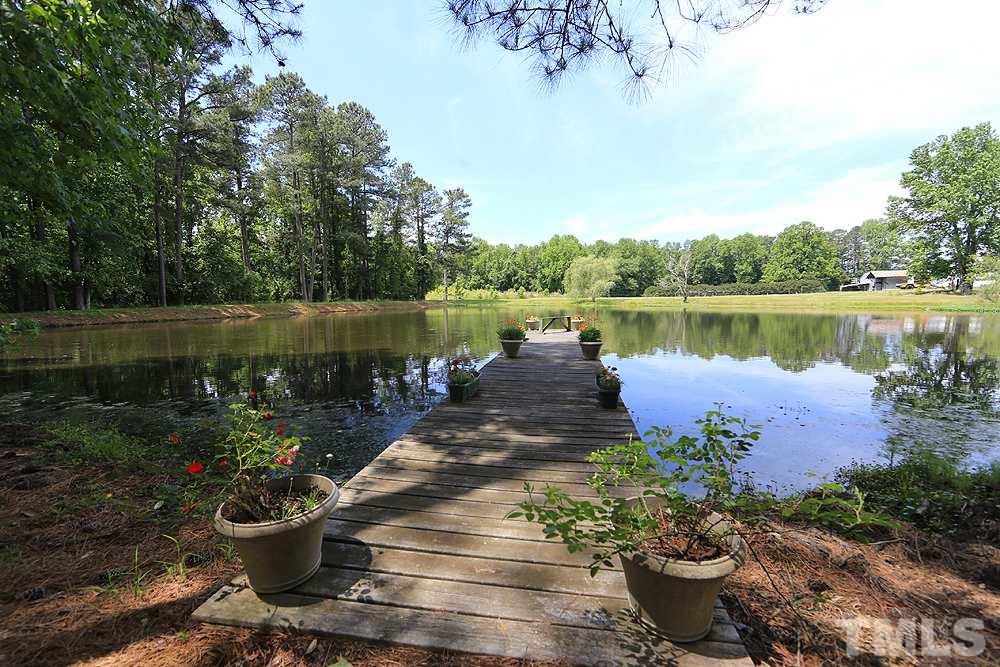 1295 Pilot-Riley Road Zebulon, NC 27597 - Photo 17 of 18 a lake view with a seating space and lake view