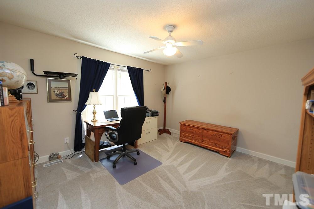 1295 Pilot-Riley Road Zebulon, NC 27597 - Photo 8 of 18 a view of a workspace with furniture and a window