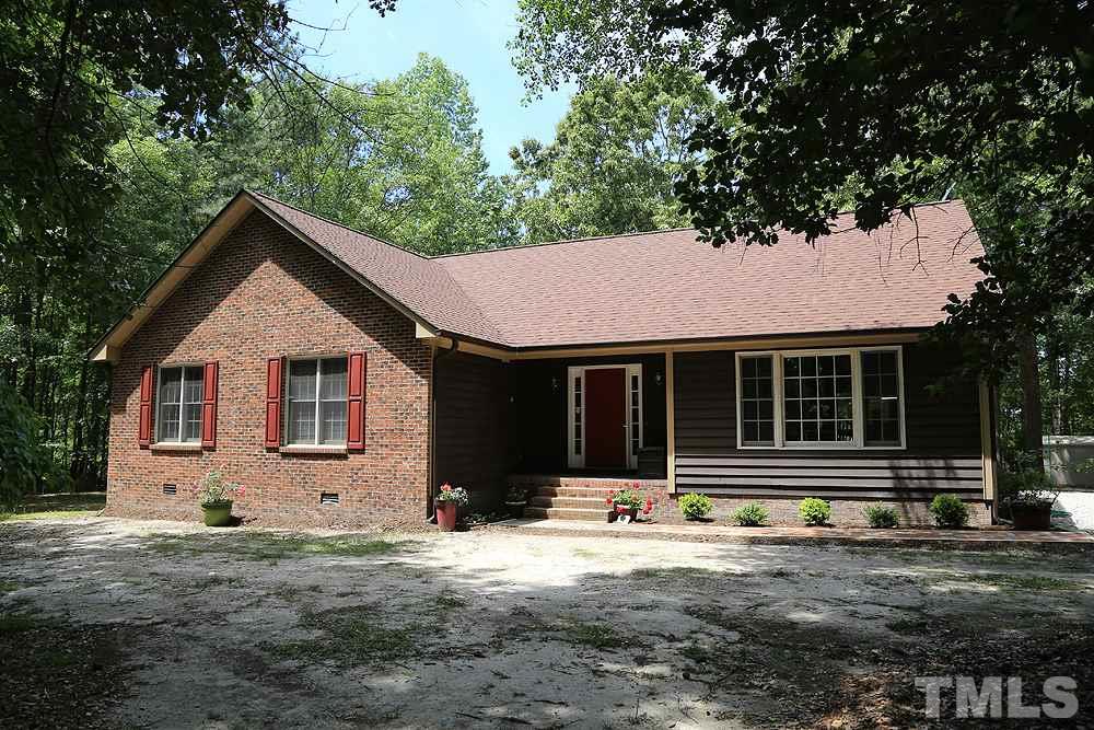 1295 Pilot-Riley Road Zebulon, NC 27597 - Photo 9 of 18 a front view of a house with a yard