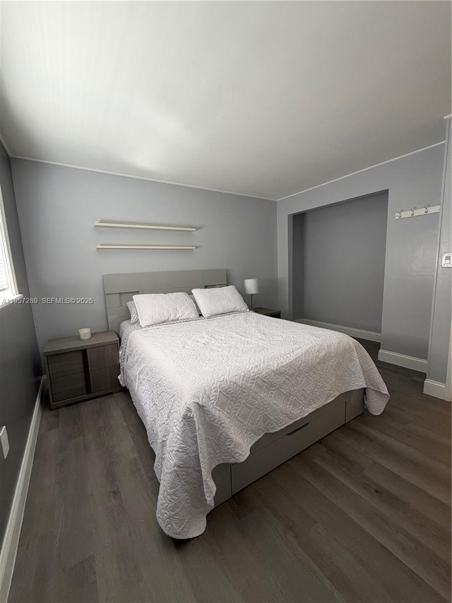 8260 Southwest 149th Court, Unit 9204 Miami, FL 33193 - Photo 14 of 25 a large bed sitting in a bedroom next to a window