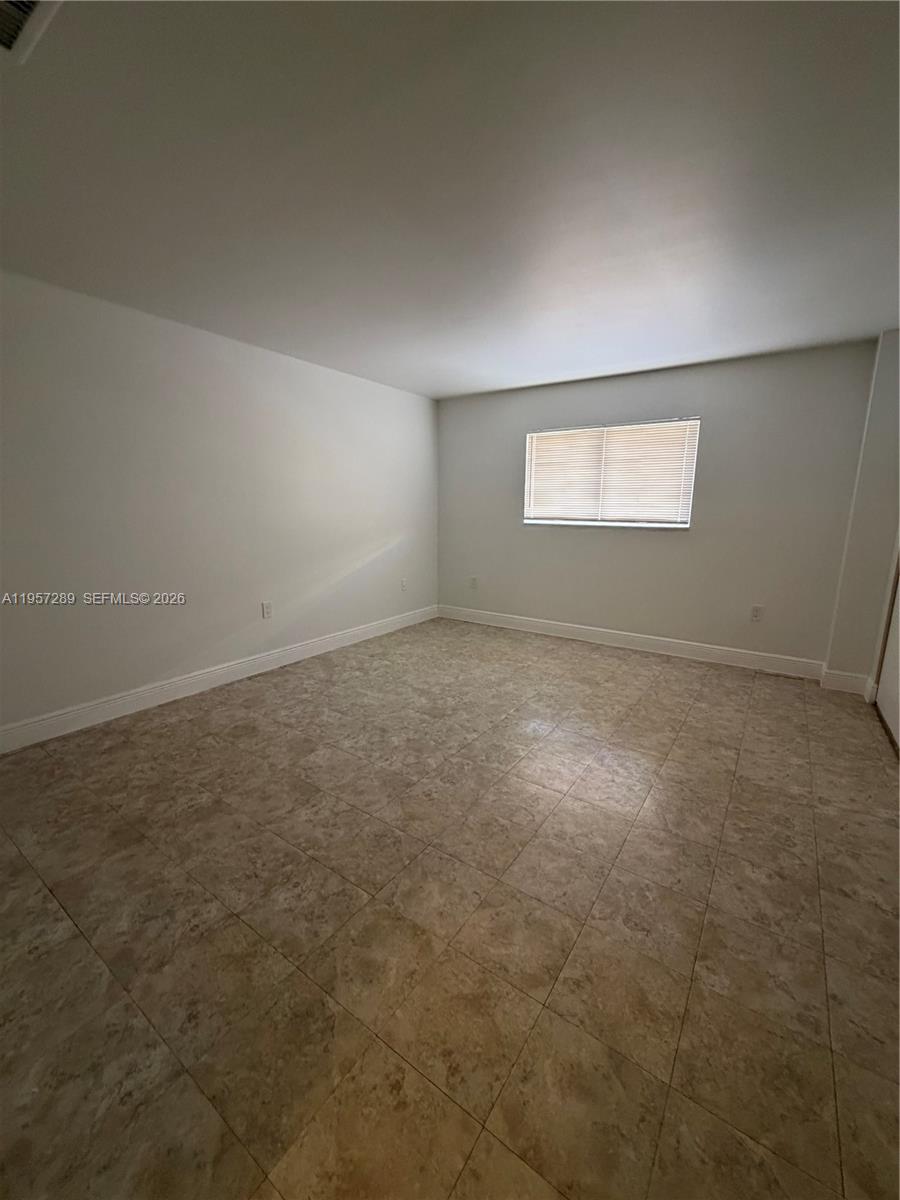 8260 Southwest 149th Court, Unit 9204 Miami, FL 33193 - Photo 19 of 25 an empty room with windows