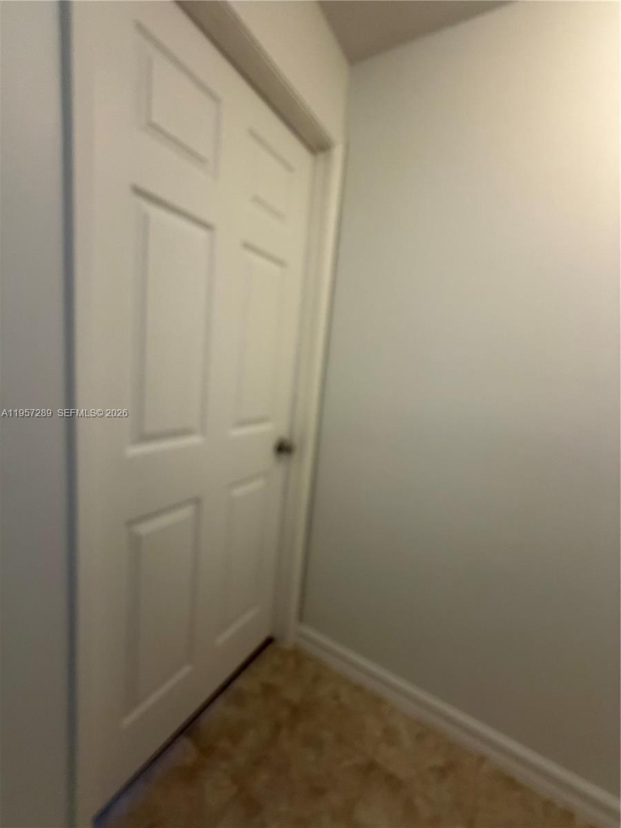 8260 Southwest 149th Court, Unit 9204 Miami, FL 33193 - Photo 21 of 25 an empty room with closet