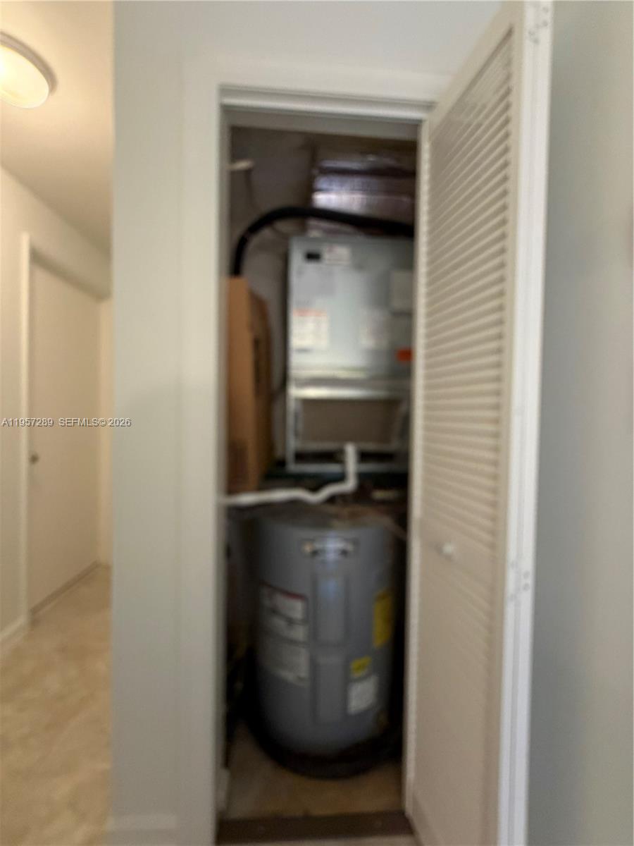 8260 Southwest 149th Court, Unit 9204 Miami, FL 33193 - Photo 25 of 25 a kitchen with a stove and a refrigerator