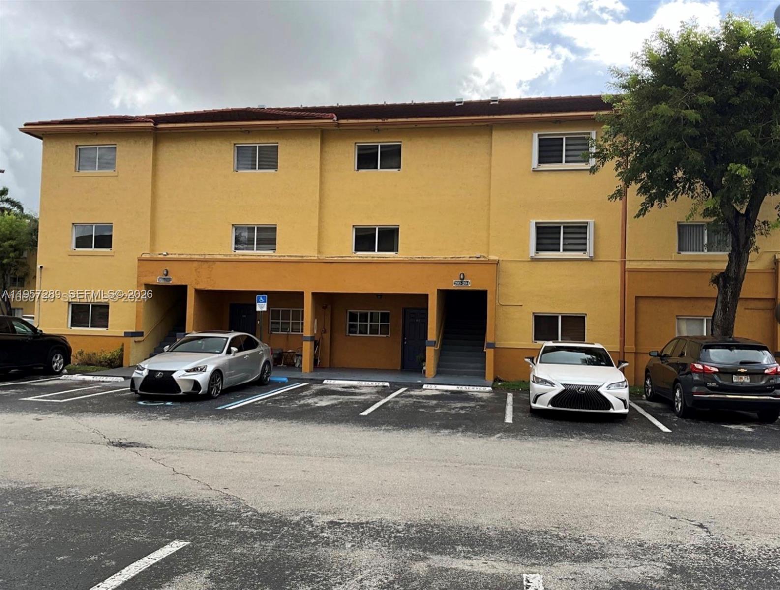 8260 Southwest 149th Court, Unit 9204 Miami, FL 33193 - Photo 3 of 25 a car parked in front of a house