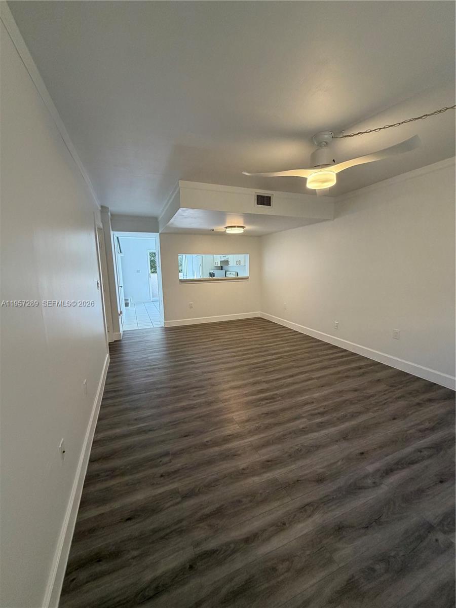 8260 Southwest 149th Court, Unit 9204 Miami, FL 33193 - Photo 6 of 25 a view of an empty room and wooden floor