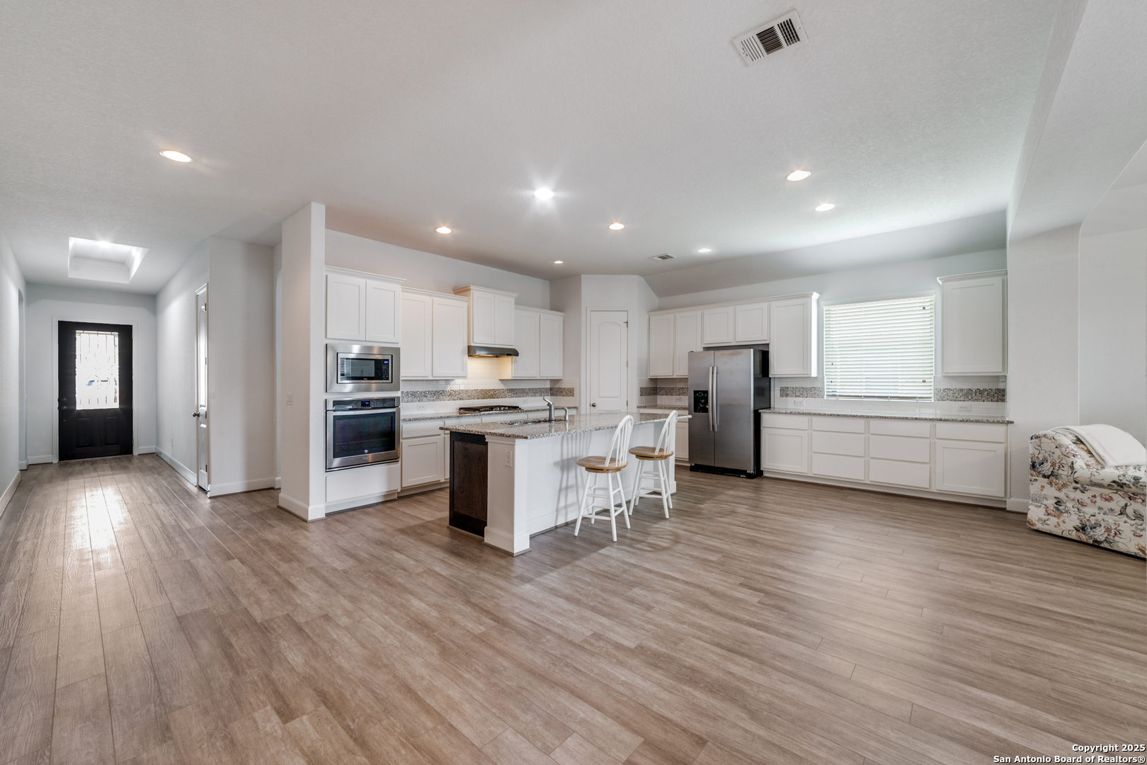836 Silver Fox Cibolo, TX 78108 - Photo 5 of 26 a view of kitchen with refrigerator microwave and cabinets