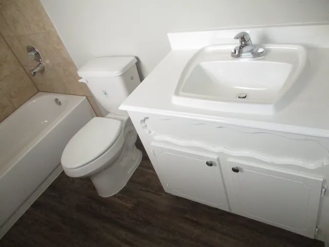 a bathroom with a toilet and a sink