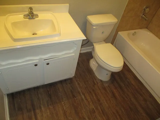 a view of a house with a yard and garage